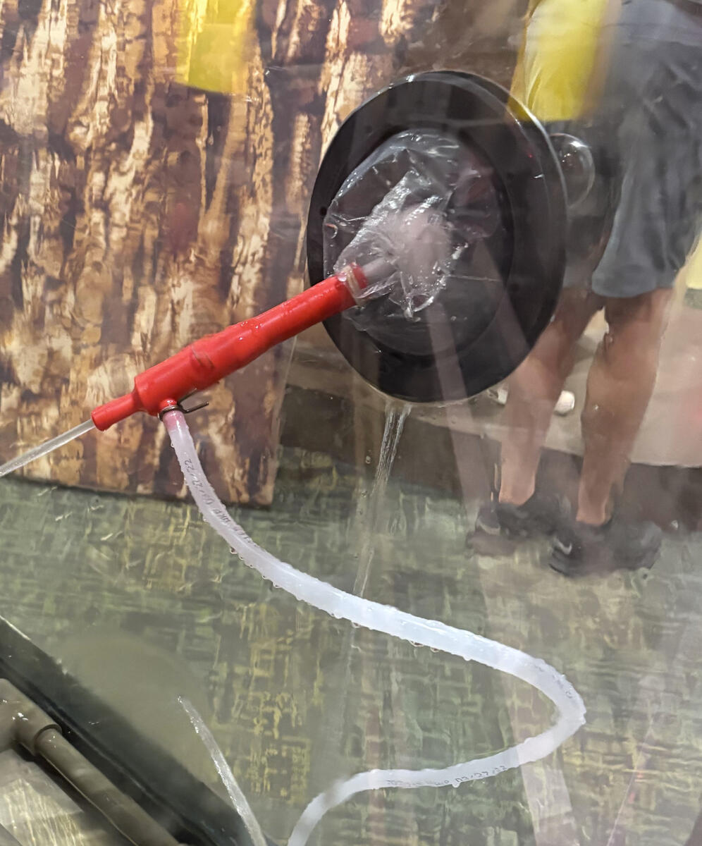 Nozzle and boot installed in cube